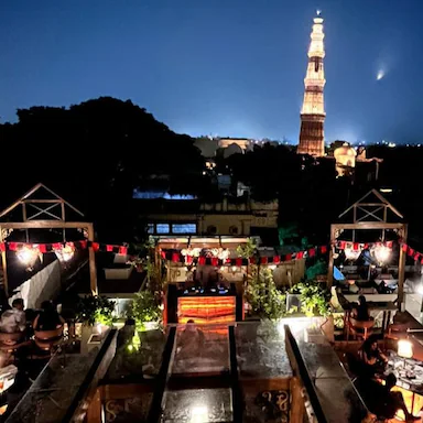 Dramz Delhi romantic rooftop cafe with Qutub Minar view